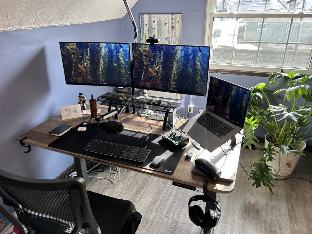 Premium Photo  Workstation with adjustable height desk cozy chair and  privacy screen created with generative ai